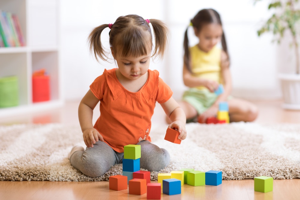 At two to three years, children should be able to play alongside other children with the same toys.