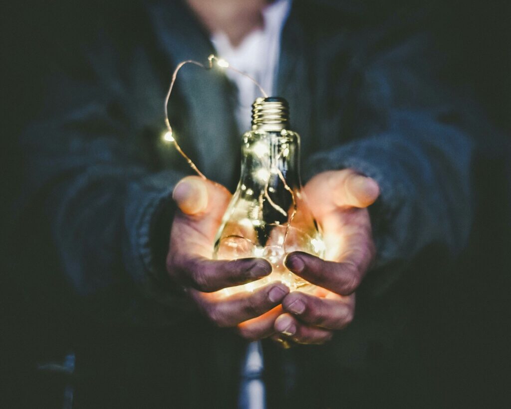 Man holding a light globe