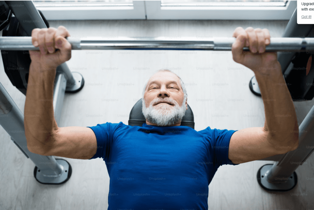 Older man doing bench press